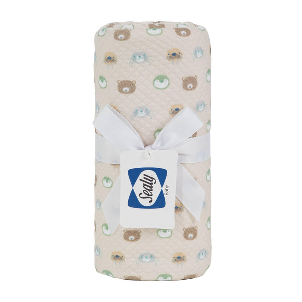 Beige Sealy baby knit blanket for newborns with cute animal faces and white ribbon