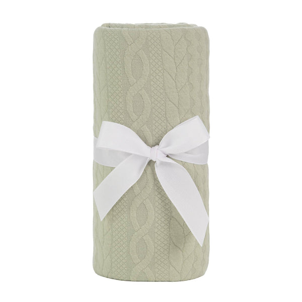 Light green Sealy baby knit blanket for newborns with cable knit pattern and white ribbon
