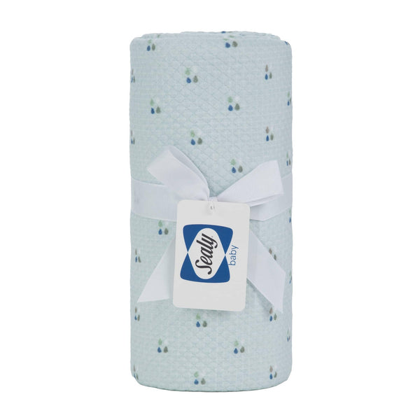 Light blue Sealy baby knit blanket with small floral pattern made of soft breathable fabric