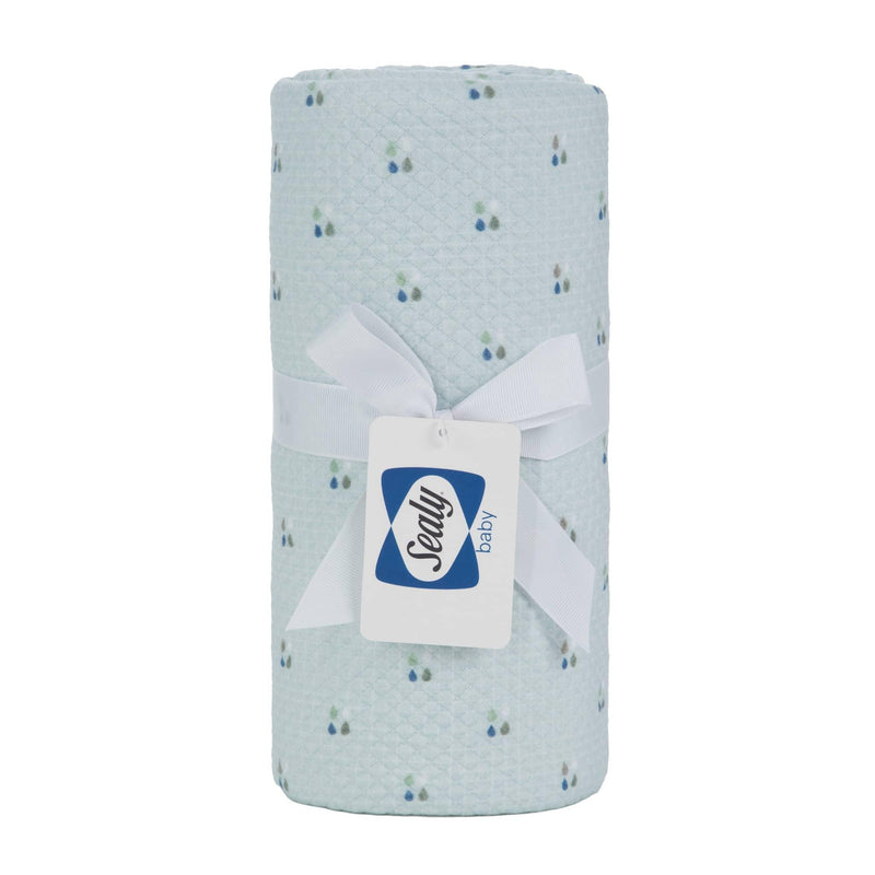 Light blue Sealy baby knit blanket with small floral pattern made of soft breathable fabric