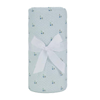 Light blue Sealy baby knit blanket with small multicolor dot pattern made of soft breathable fabric