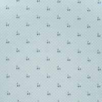 Light blue Sealy baby knit blanket with small multicolor tree pattern made of soft knit fabric