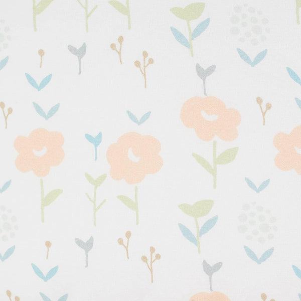 Toddler pouf seat for playroom with soft white fabric featuring pastel floral and leaf pattern