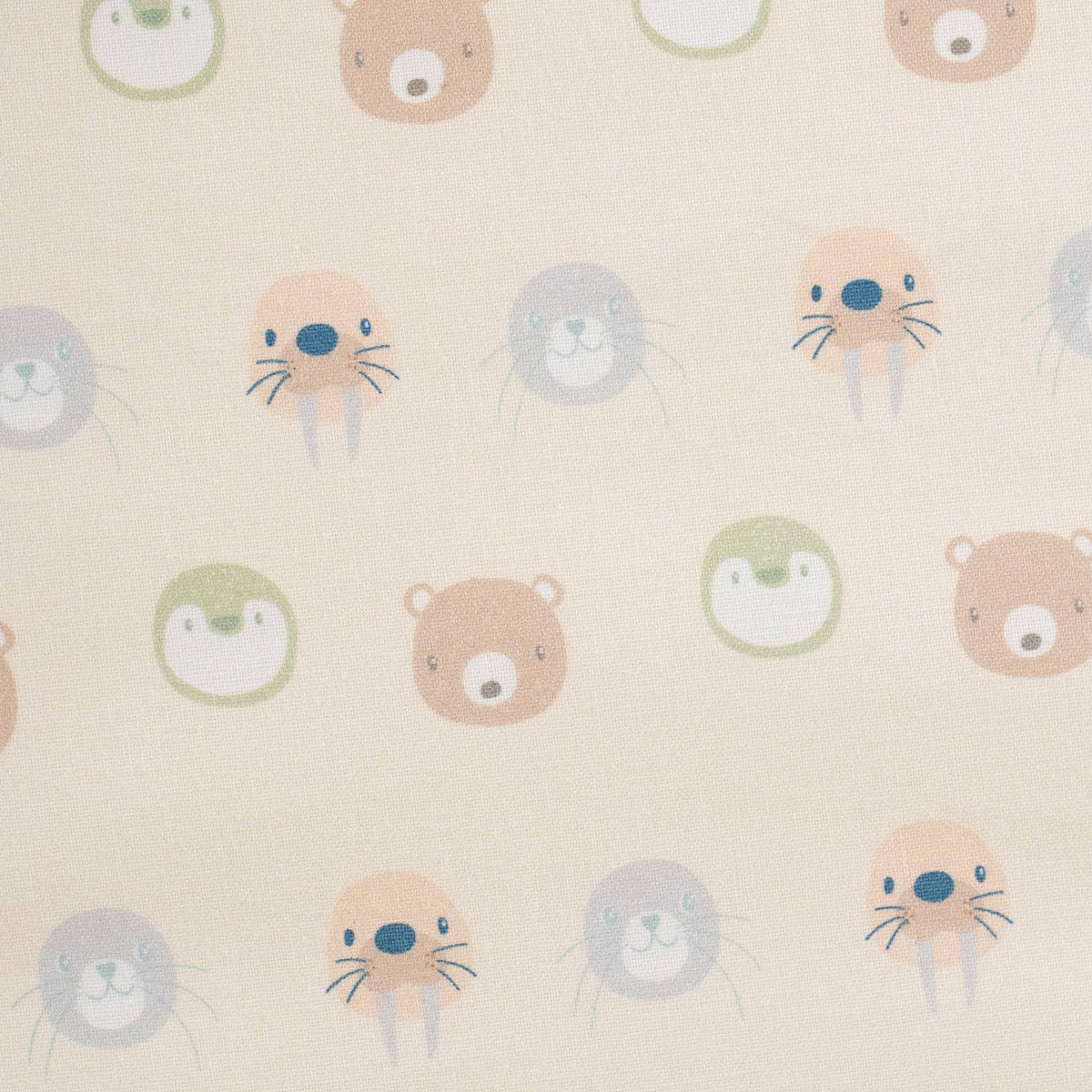Close-up of beige Sealy children's floor cushion fabric with pastel animal faces for toddlers