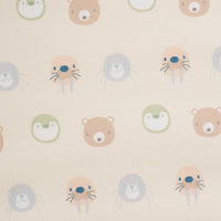 Close-up of beige Sealy children's floor cushion fabric with pastel animal faces for toddlers