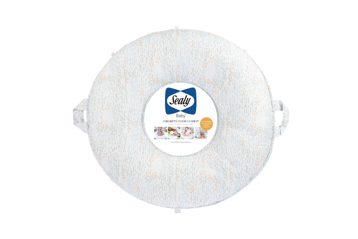 Sealy baby floor cushion in light gray with orange dots and side handles for easy carrying