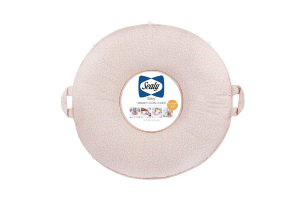 round pink floral floor cushion for toddlers by Sealy with handles for easy carrying