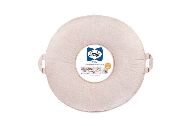 round pink floral floor cushion for toddlers by Sealy with handles for easy carrying