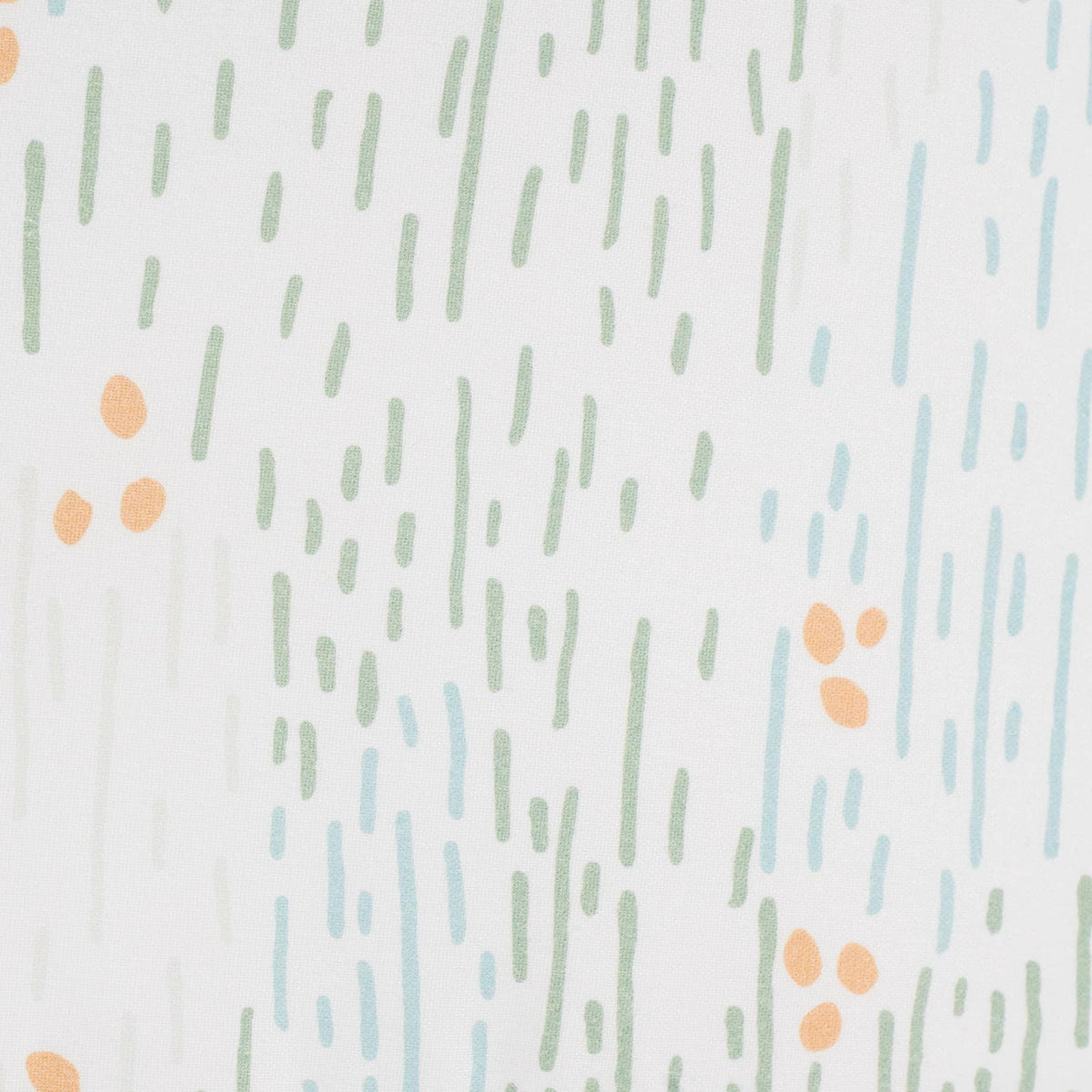 White sealy pouf for toddlers with green, blue, and orange abstract dot and line pattern