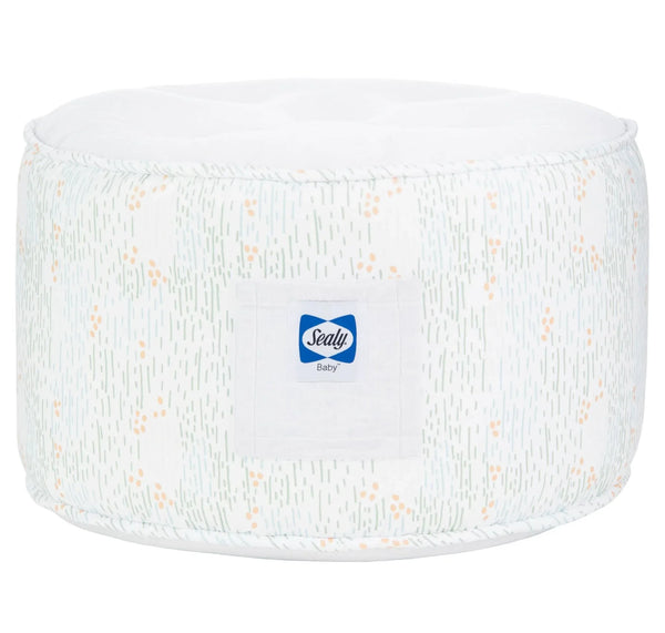 white and light green sealy pouf for toddlers with subtle orange dots and soft fabric texture