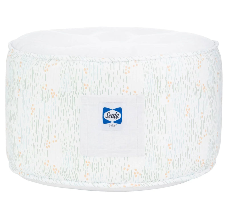 white and light green sealy pouf for toddlers with subtle orange dots and soft fabric texture