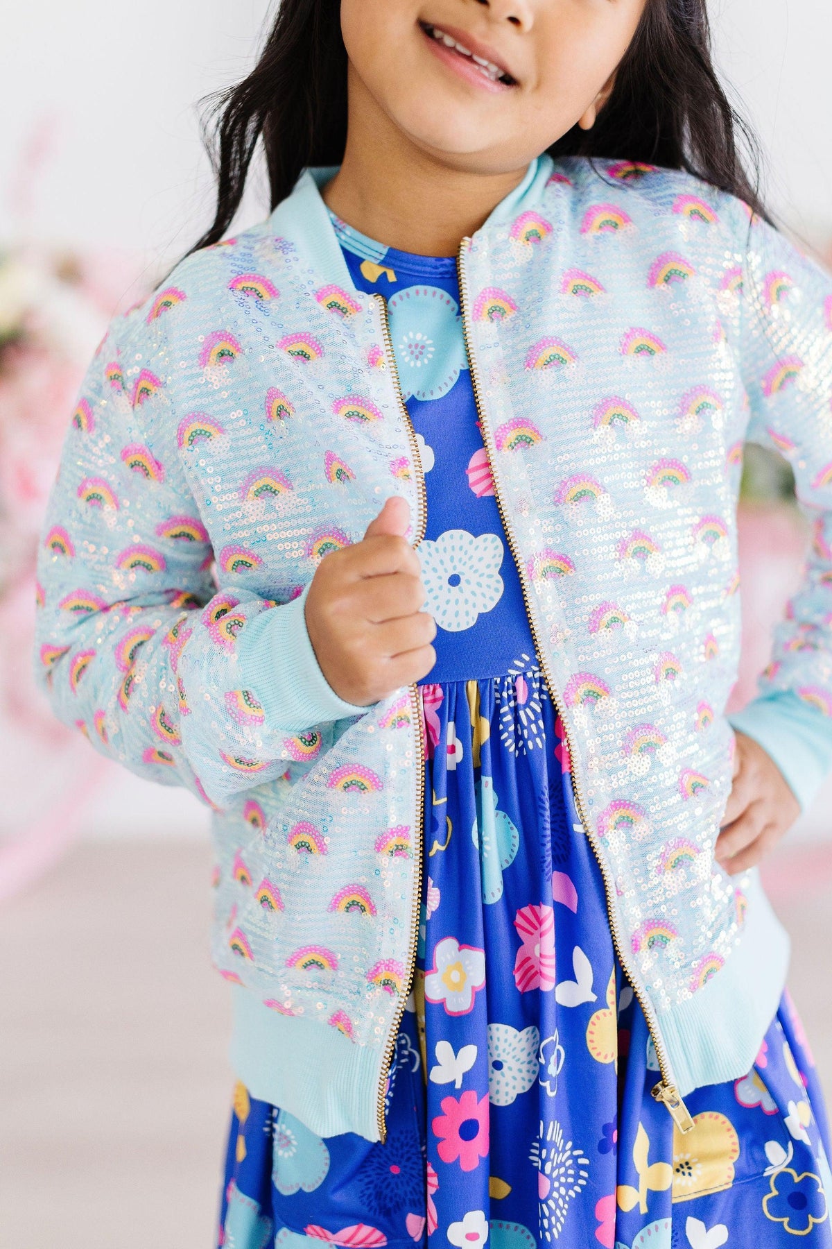 Girls light blue sequin jacket with rainbow design, long sleeve and zipper closure