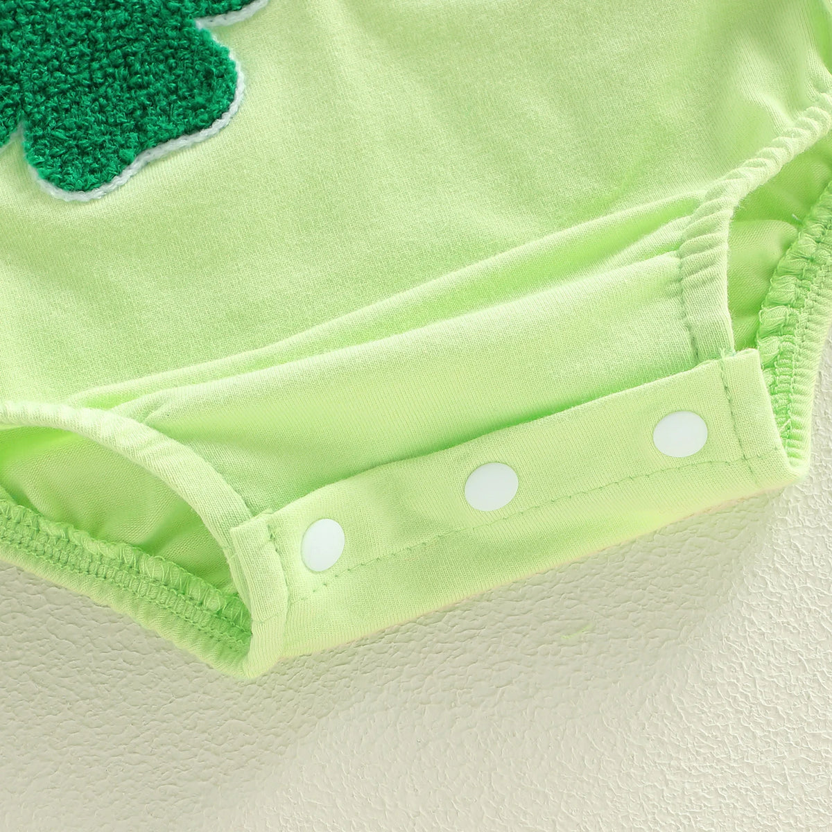 Light green cotton shamrock embroidered baby bubble romper with snap closures