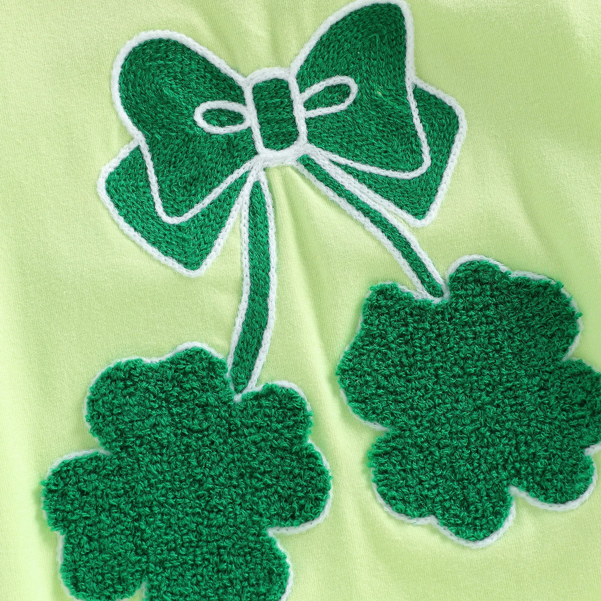 Light green cotton baby romper with shamrock embroidered baby bubble design in dark green thread