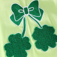 Light green cotton baby romper with shamrock embroidered baby bubble design in dark green thread