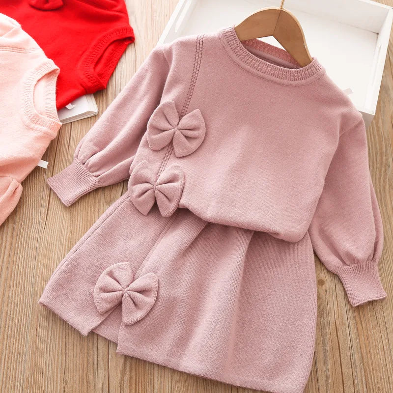 Toddler girls pink skirt set with long sleeves and decorative bows, soft knit fabric