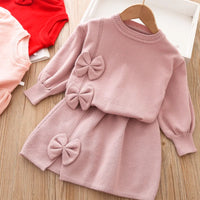 Toddler girls pink skirt set with long sleeves and decorative bows, soft knit fabric