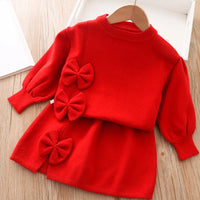 Girls red skirt set with long sleeve top and three bow accents for toddlers