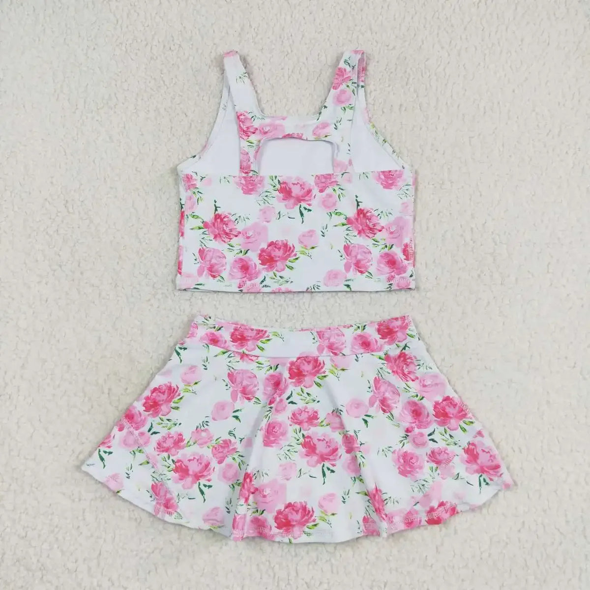 Girls white and pink floral skort outfit with sleeveless crop top and flared skirt for toddlers