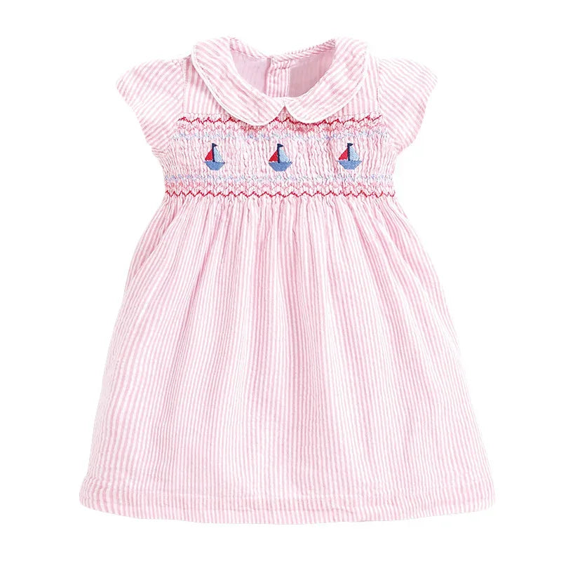 baby pink smocked dress with sailboat embroidery and Peter Pan collar for infants