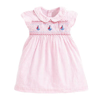 baby pink smocked dress with sailboat embroidery and Peter Pan collar for infants