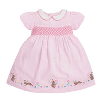 baby pink smocked dress with white collar and bunny floral embroidery for infants