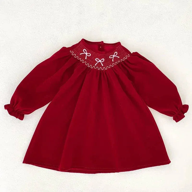 baby girls red smocked dress with long sleeves and white bow embroidery on smocked neckline