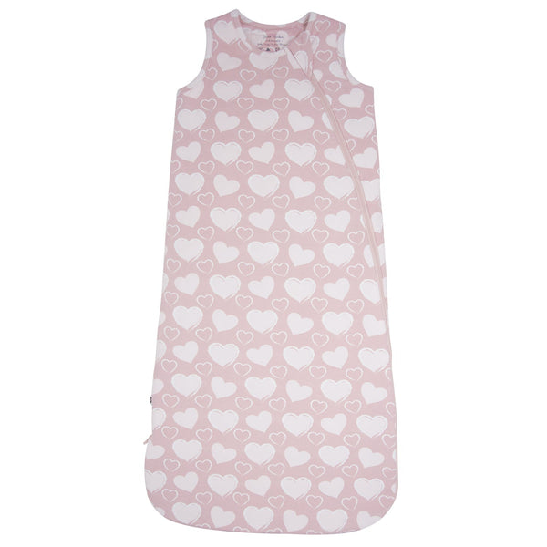 Pink baby sleeping bag with white heart pattern on a white background