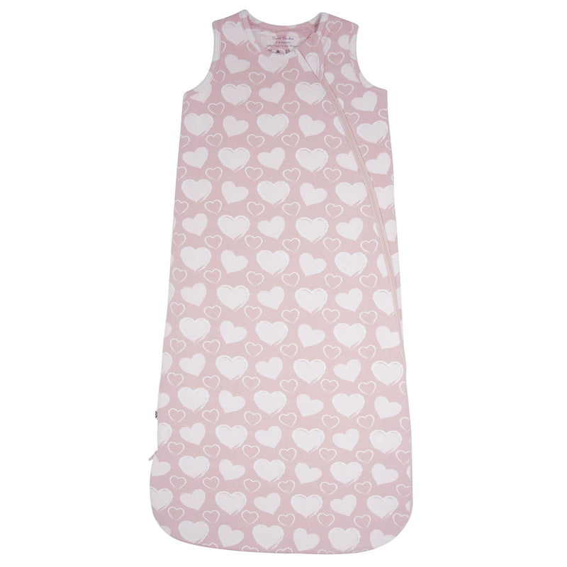 Pink baby sleeping bag with white heart pattern on a white background