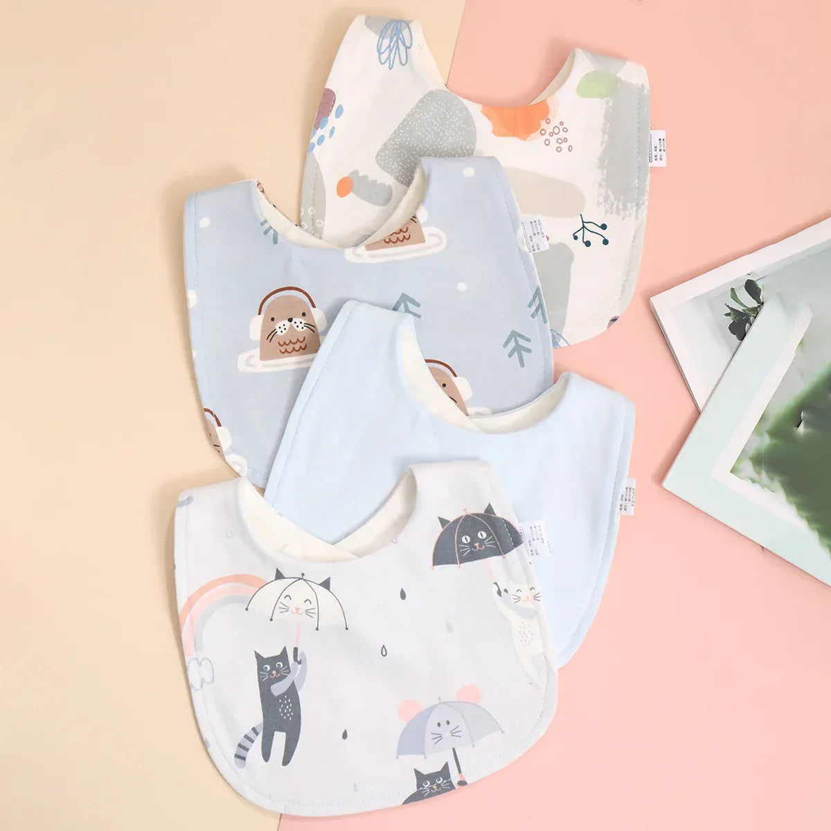 Soft cotton baby bib set with animal and umbrella prints, pastel colors, suitable for infants and toddlers