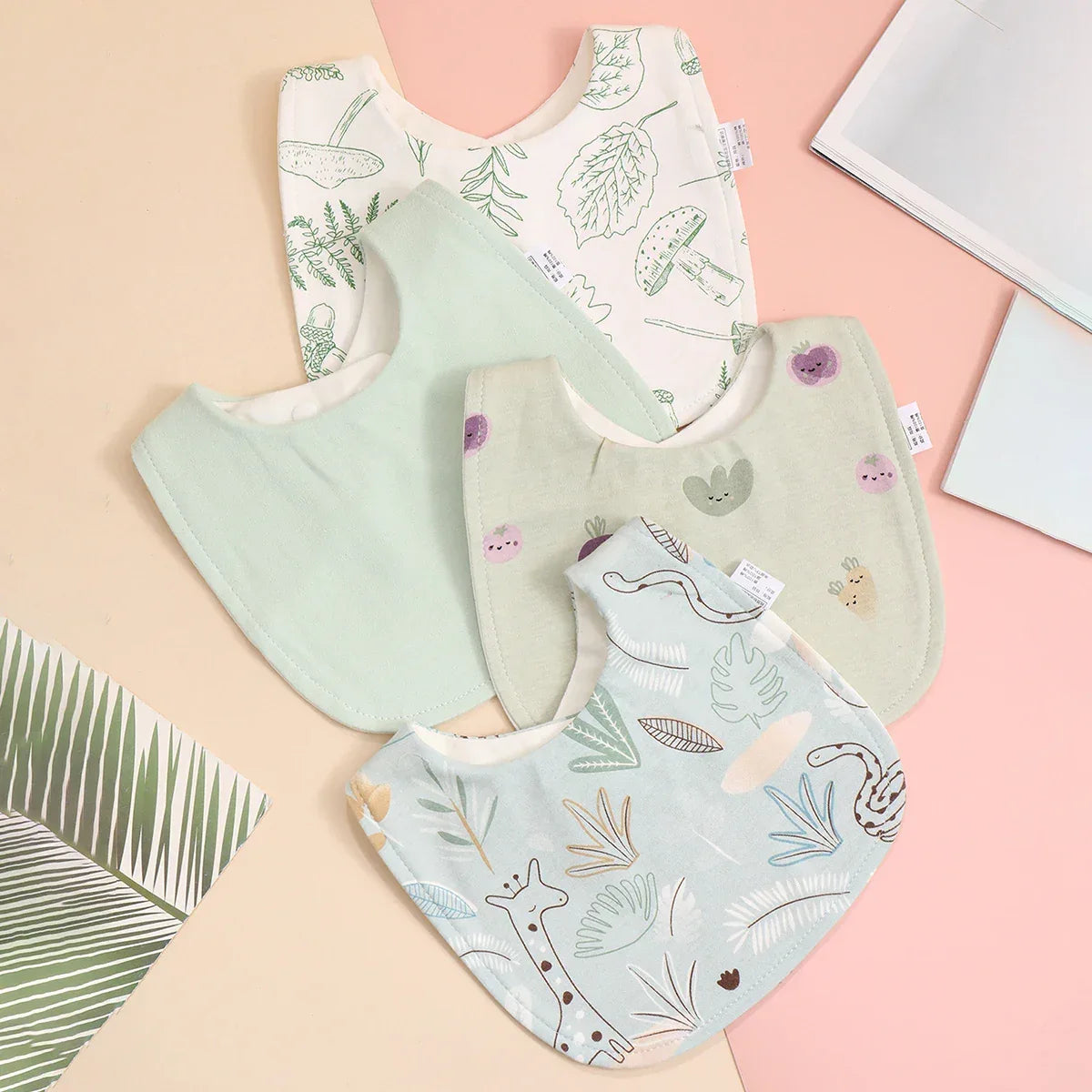 soft cotton baby bib set with pastel green, beige, and white colors featuring nature and animal prints for babies