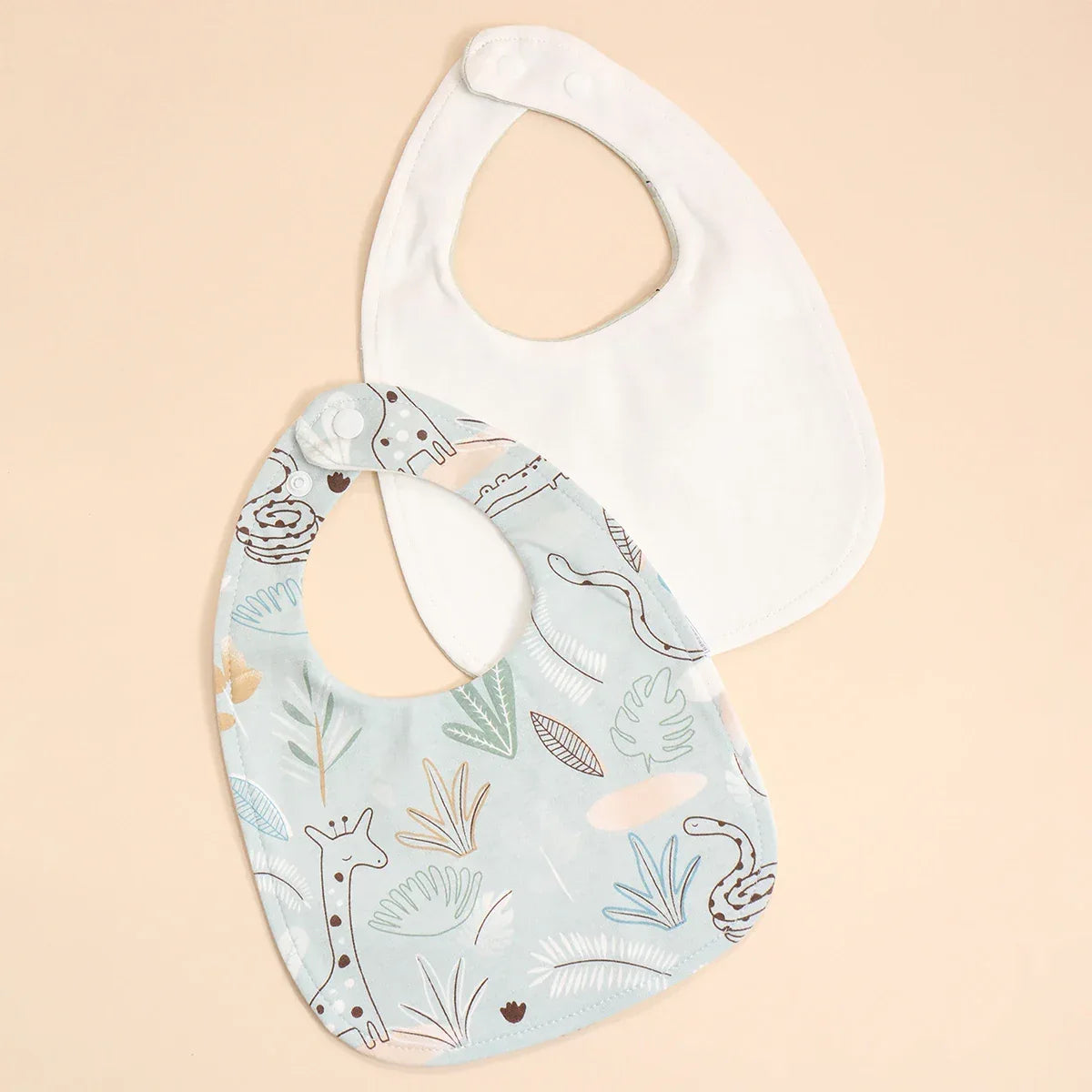 Soft cotton baby bib set with blue animal print and plain white bibs for infants