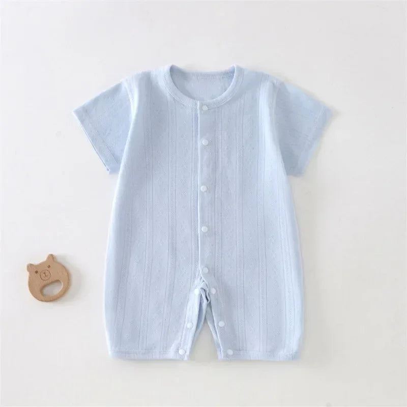 soft cotton baby romper in light blue for newborns with short sleeves and front snap buttons