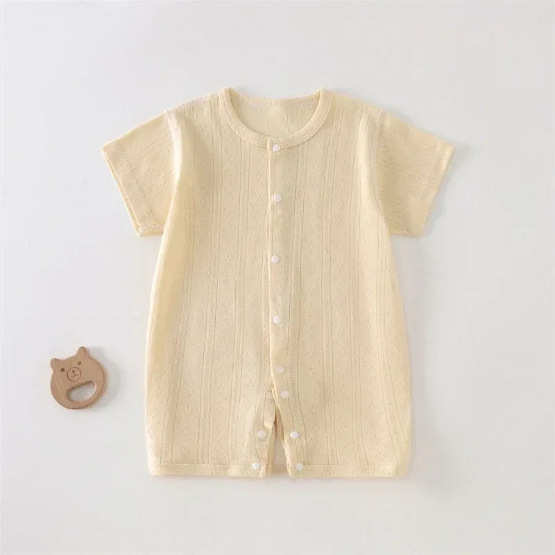 cream soft cotton baby romper for newborns with short sleeves and front snap buttons