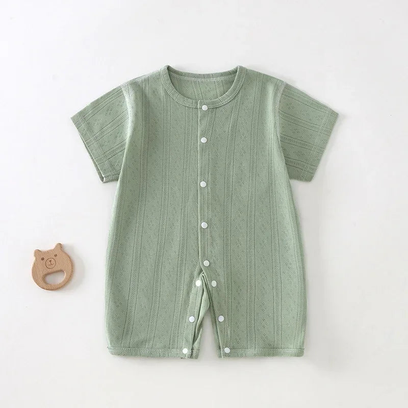 soft cotton baby romper in light green for infants with short sleeves and front snap buttons