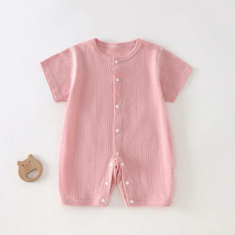 Pink soft cotton baby romper for newborns with short sleeves and front button closure