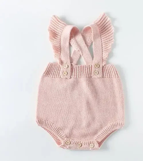 Pink soft knit baby romper for infants with ruffled shoulder straps and button closures