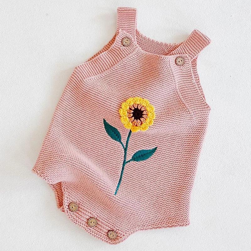 soft knit baby romper in pink for infants with yellow sunflower embroidery and button straps