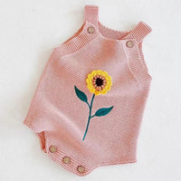 soft knit baby romper in pink for infants with yellow sunflower embroidery and button straps