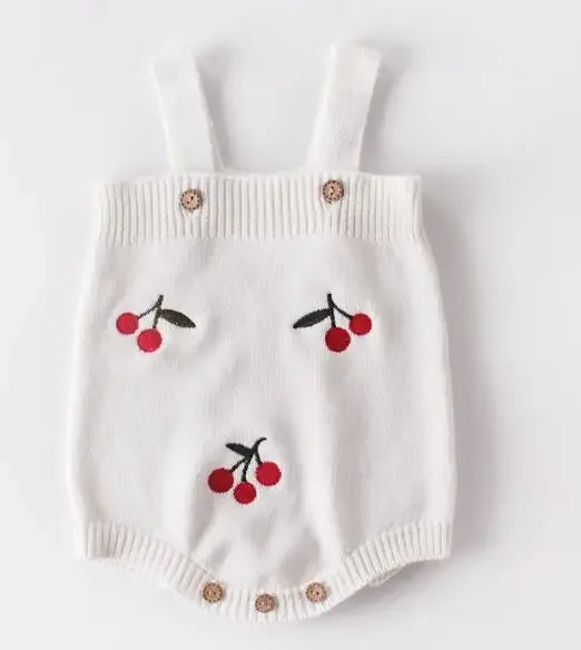 white soft knit baby romper with red cherry pattern, sleeveless for newborns and infants