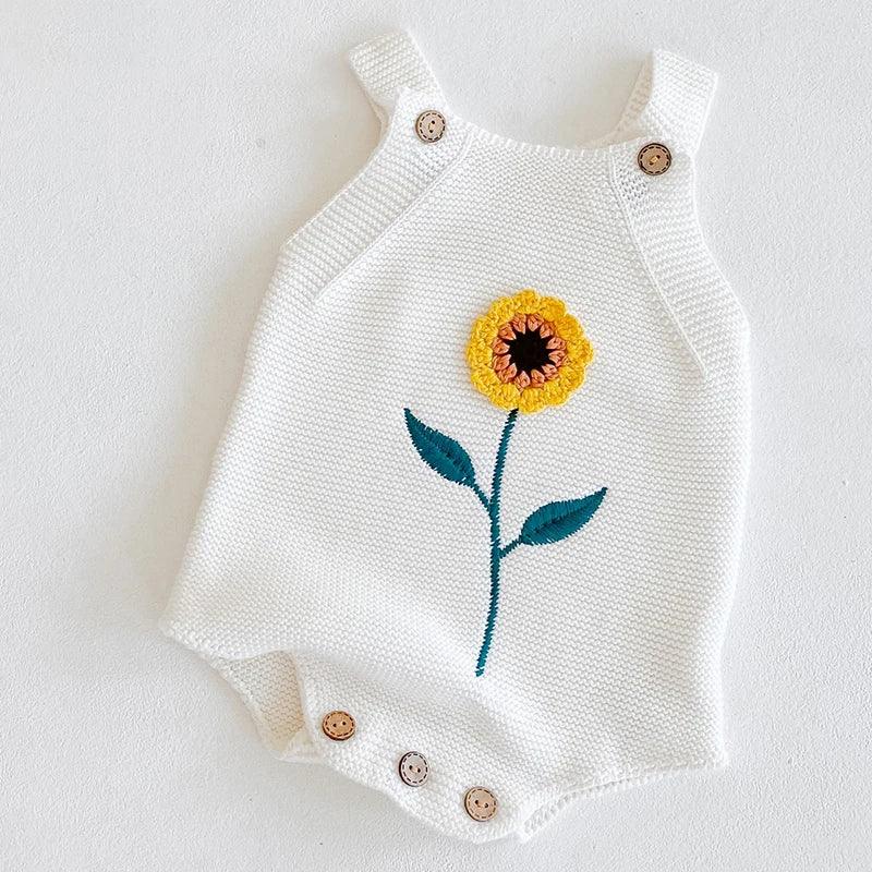 white soft knit baby romper with yellow sunflower embroidery and wooden buttons for infants