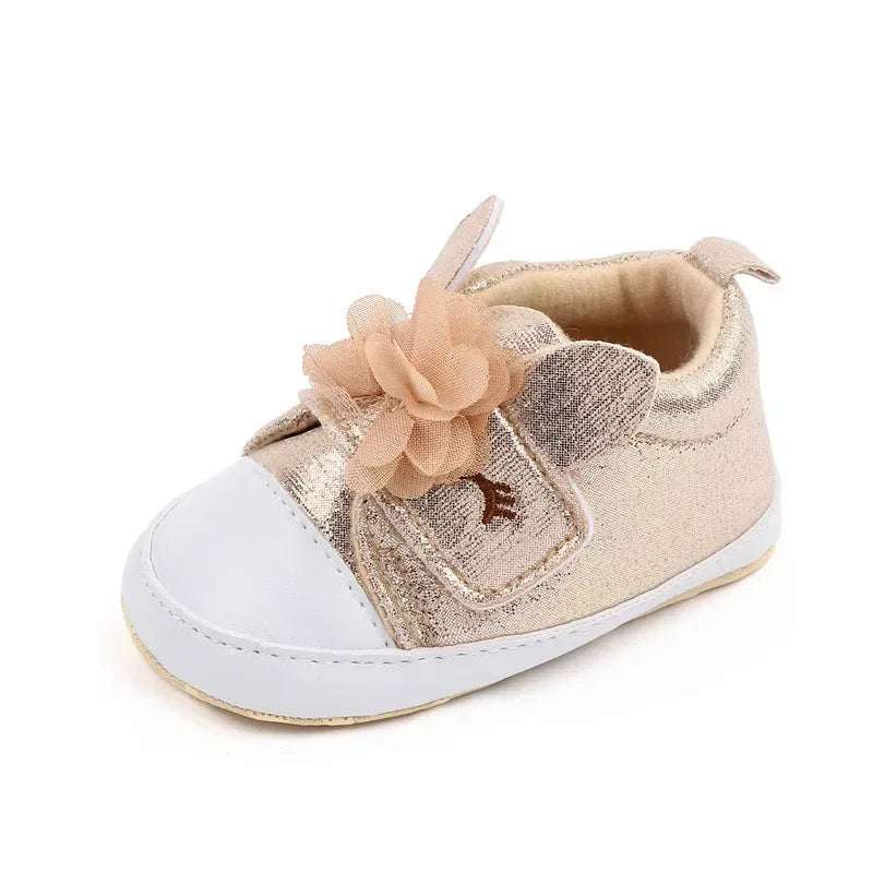 gold soft sole baby shoes with flower and wing detail for infants