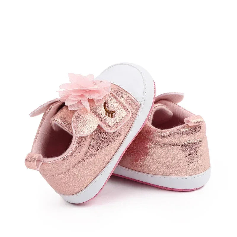 pink glitter soft sole baby shoes with flower decoration for infants, side view