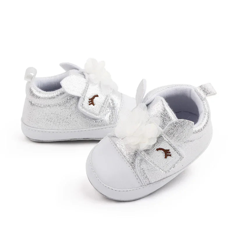silver soft sole baby shoes with white flower decoration for infants age 0 to 6 months
