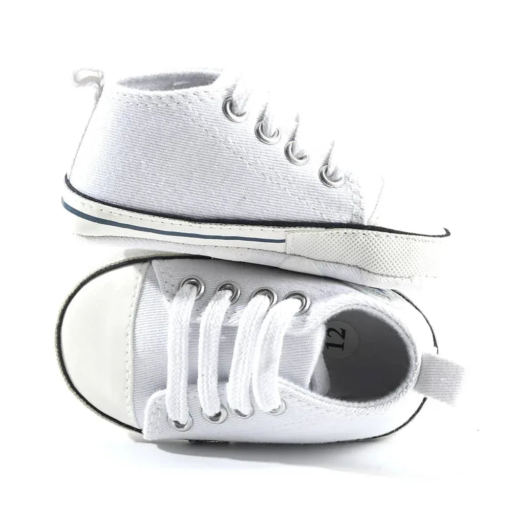 White soft sole baby shoes for infants size 12 shown from side and top view