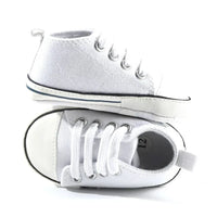 White soft sole baby shoes for infants size 12 shown from side and top view