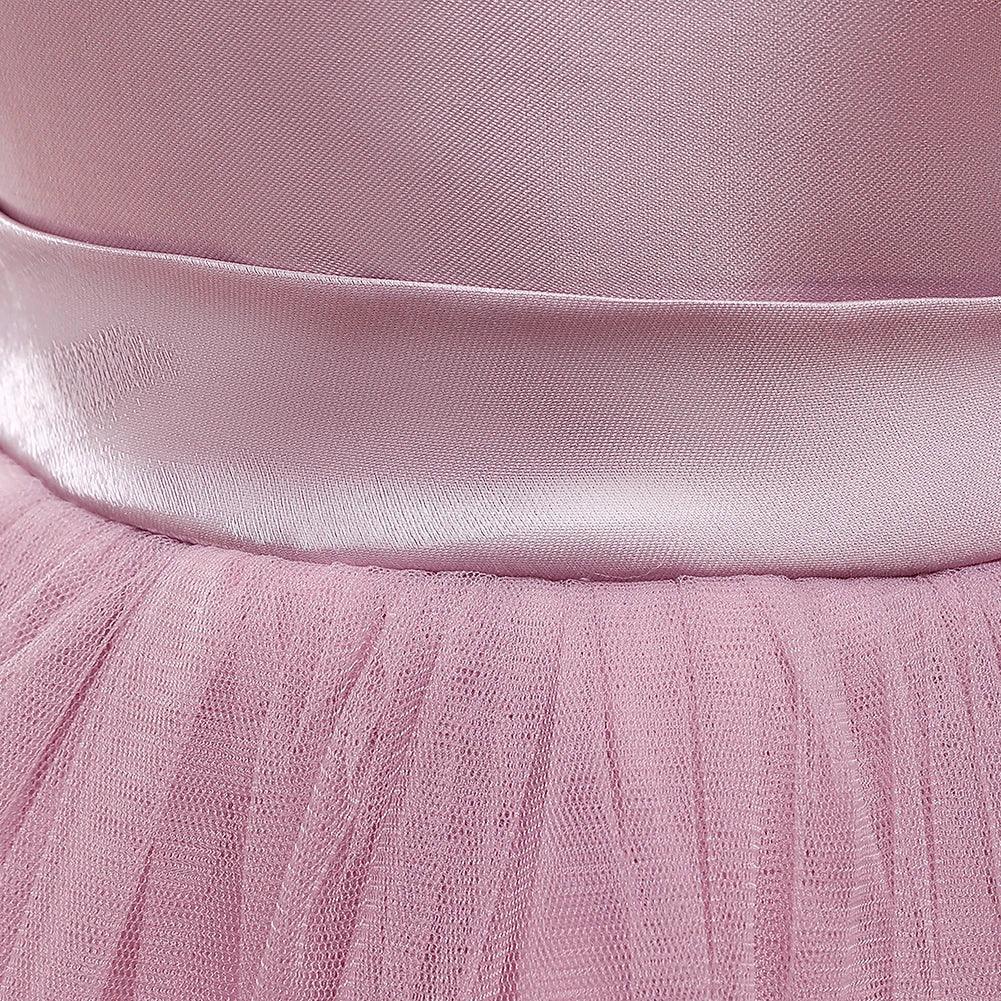 close-up of pink baby special occasion dress with satin waistband and tulle skirt
