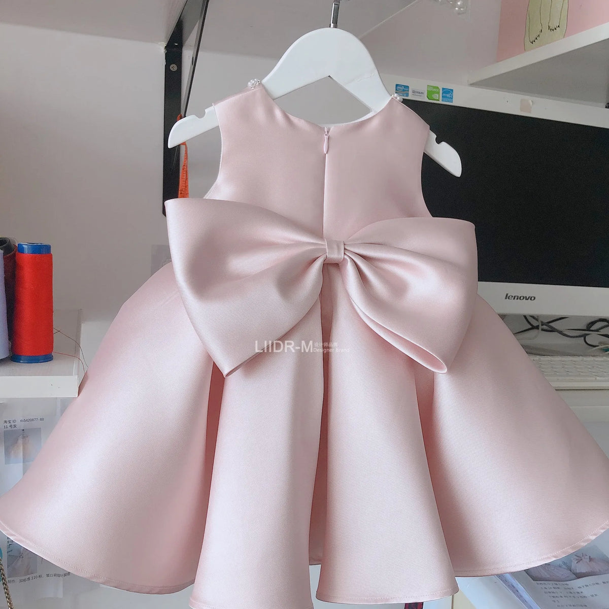 baby pink special occasion dress with large bow on back sleeveless for toddlers