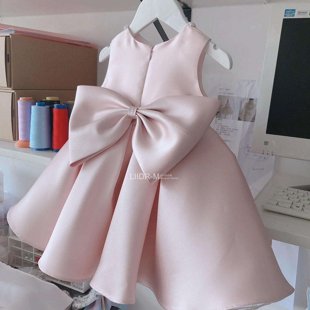 baby pink satin special occasion dress with large bow back for toddlers