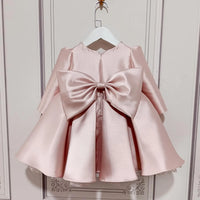 baby pink special occasion dress with large satin bow back for infants and toddlers